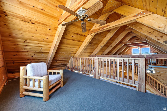 10937 South County Road, Unit 29 Duchesne, UT 84021 - Photo 24 of 41 Loft space featuring exposed wood beams and a slatted wood railing