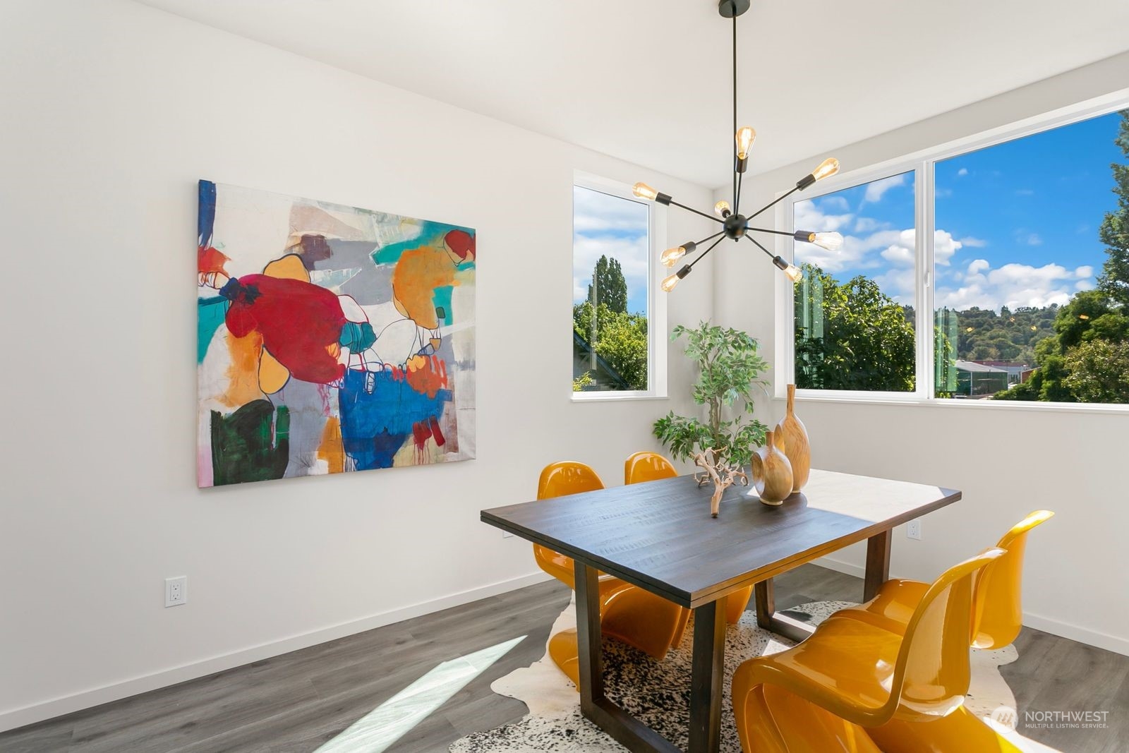 729 South Southern Street Seattle, WA 98108 - Photo 11 of 29 a view of a dining room with furniture and wooden floor
