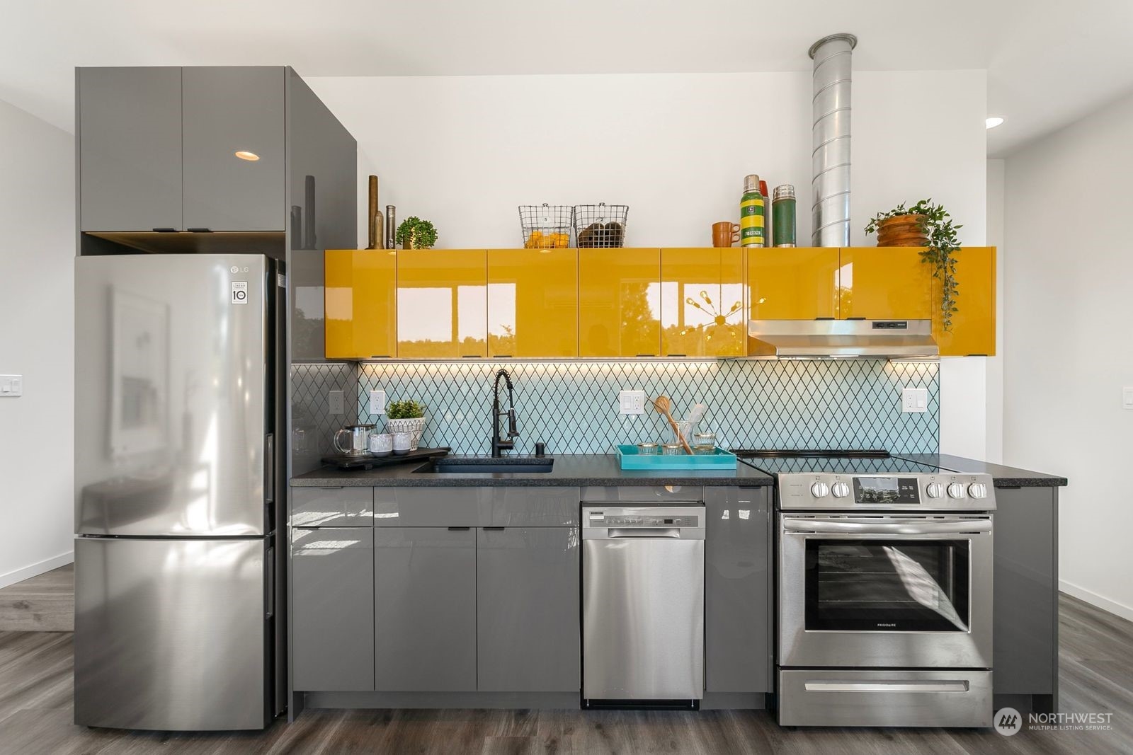 729 South Southern Street Seattle, WA 98108 - Photo 16 of 29 a kitchen with a sink and a refrigerator