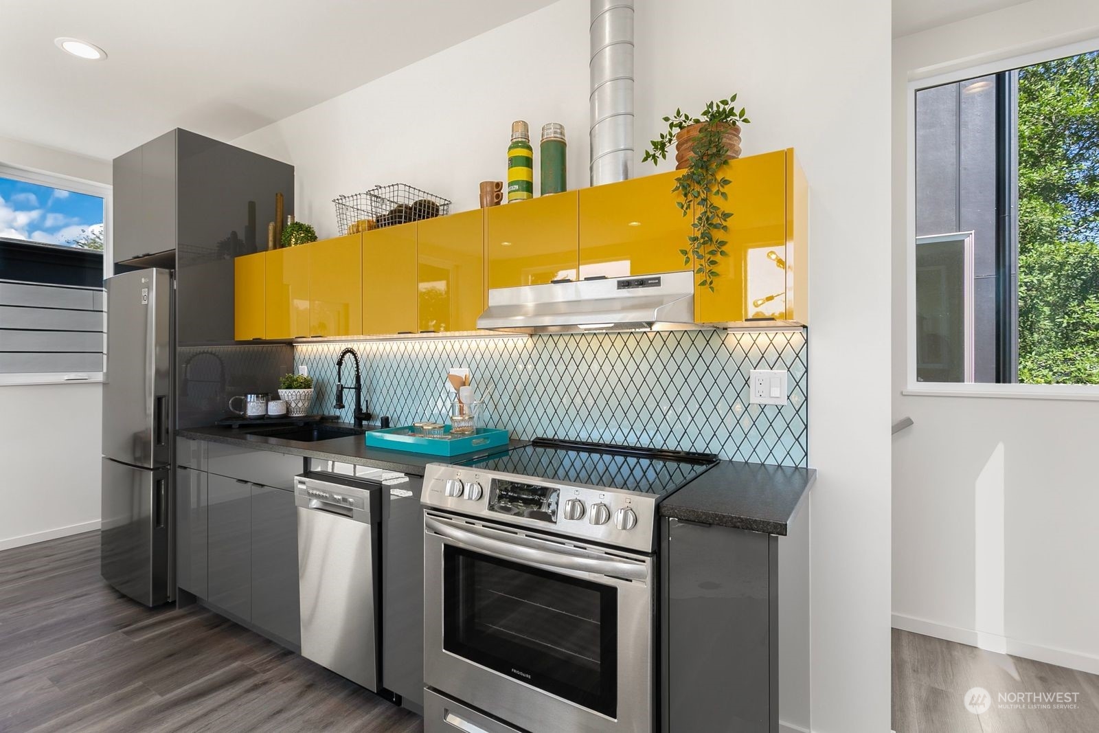 729 South Southern Street Seattle, WA 98108 - Photo 17 of 29 a kitchen with a sink and a stove
