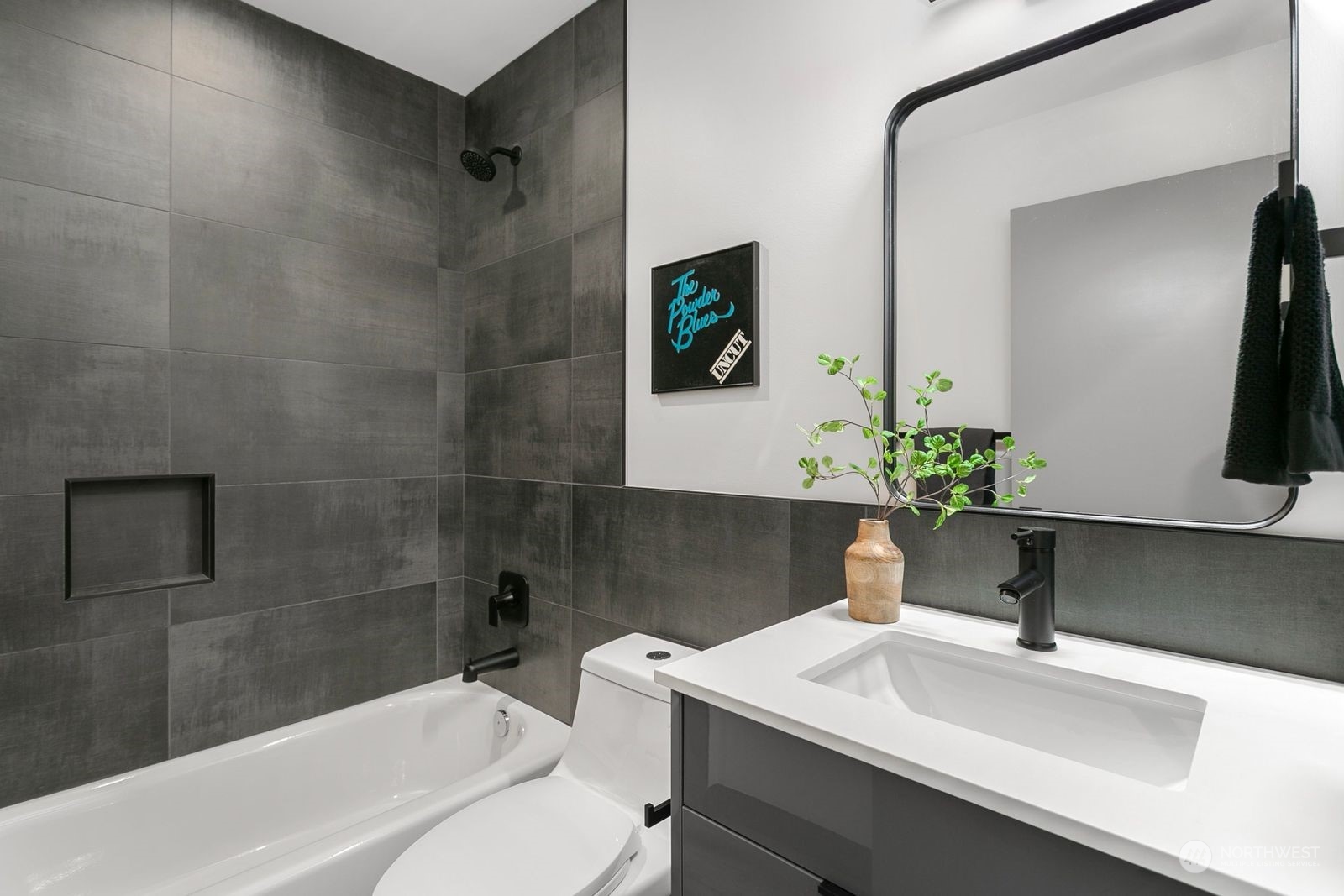 729 South Southern Street Seattle, WA 98108 - Photo 7 of 29 a bathroom with a sink a toilet and shower