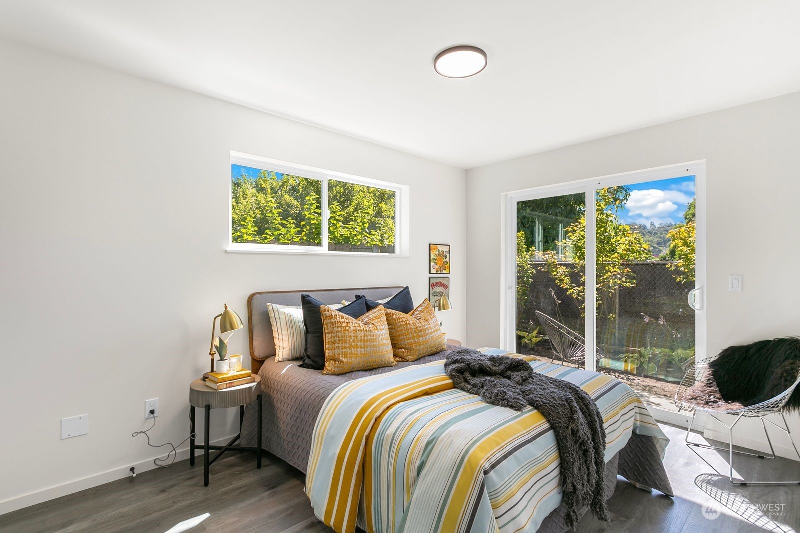 729 South Southern Street Seattle, WA 98108 - Photo 8 of 29 a bedroom with a bed and a large window