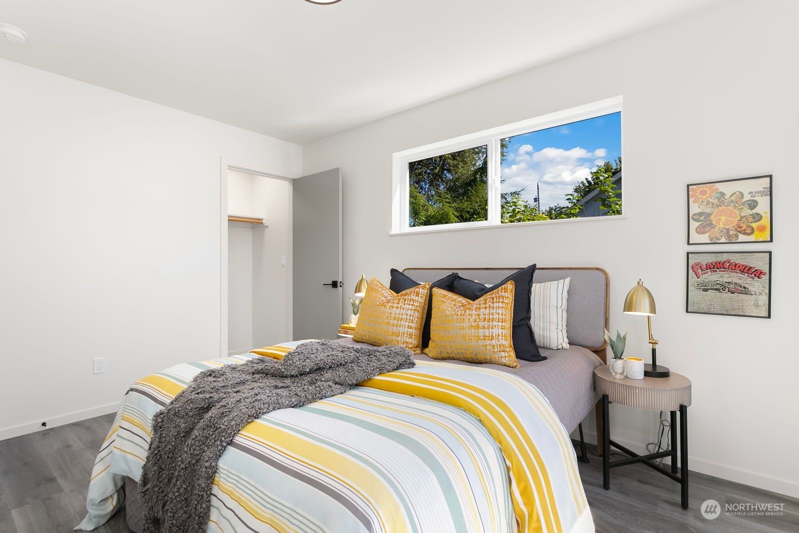729 South Southern Street Seattle, WA 98108 - Photo 9 of 29 a bedroom with bed and paintings on the wall