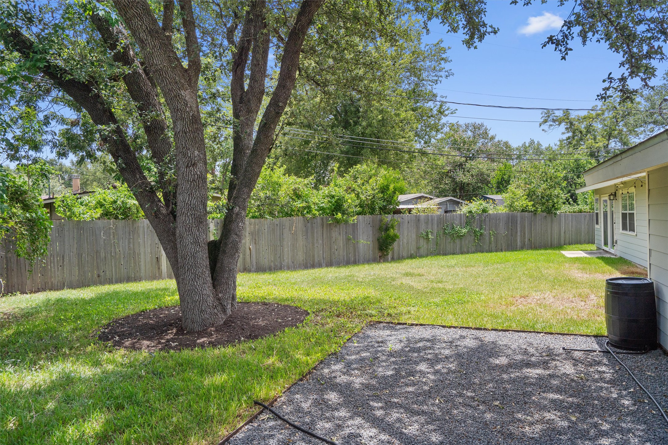 7707 Robalo Road Austin, TX 78757 - Photo 31 of 33 A generous backyard offers a private, fenced space for outdoor enjoyment.