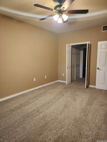 a view of an empty room with a fireplace