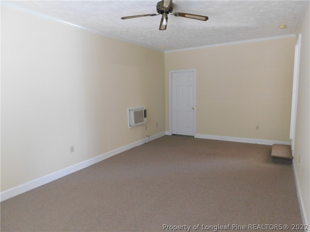 4451 Ruby Road Fayetteville, NC 28311 - Photo 13 of 14 a view of a room with a ceiling fan