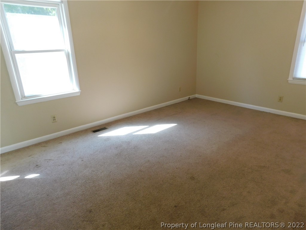 4451 Ruby Road Fayetteville, NC 28311 - Photo 10 of 14 an empty room with a window