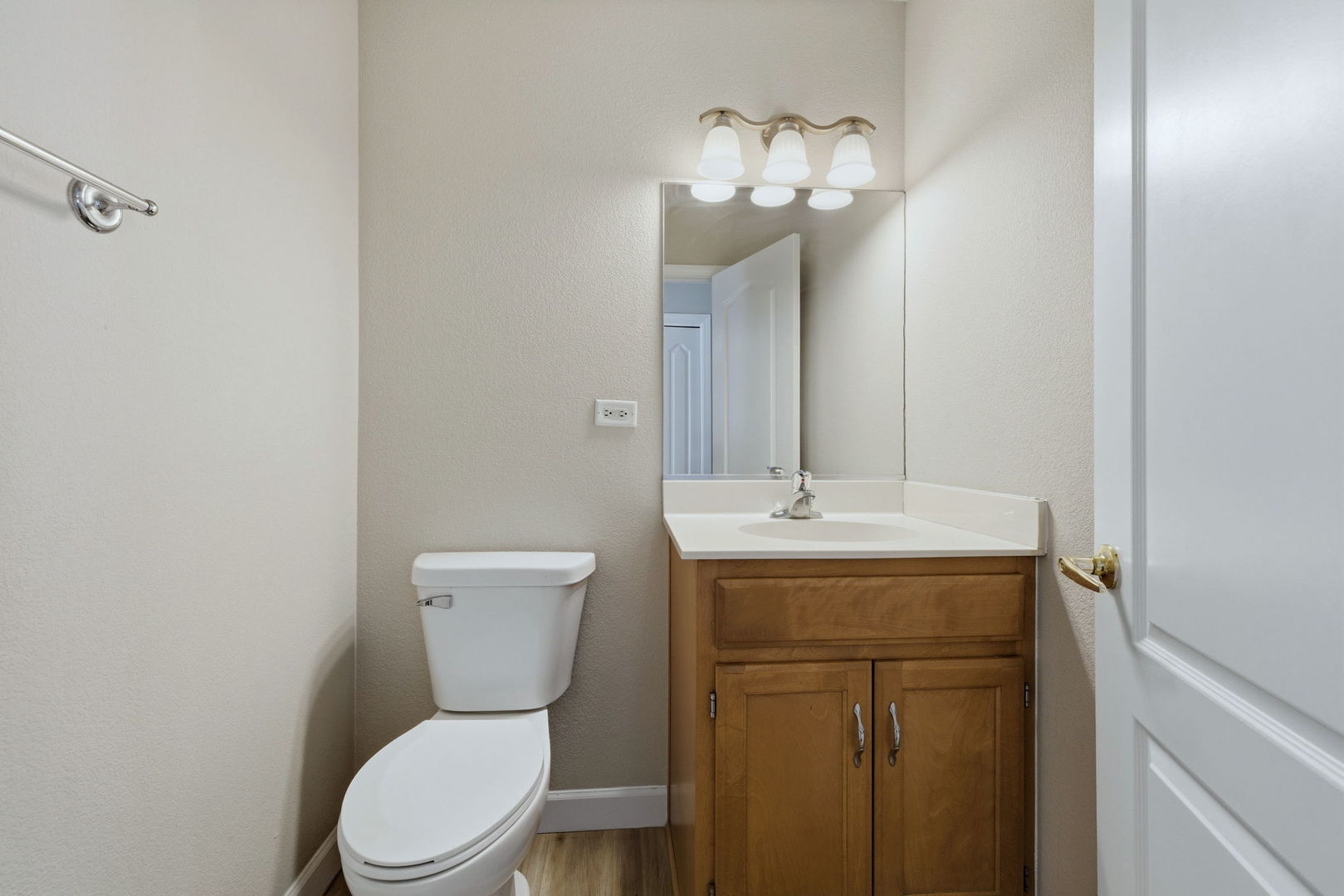 1305 Campbell Street Joliet, IL 60435 - Photo 13 of 34 a bathroom with a toilet a sink and mirror