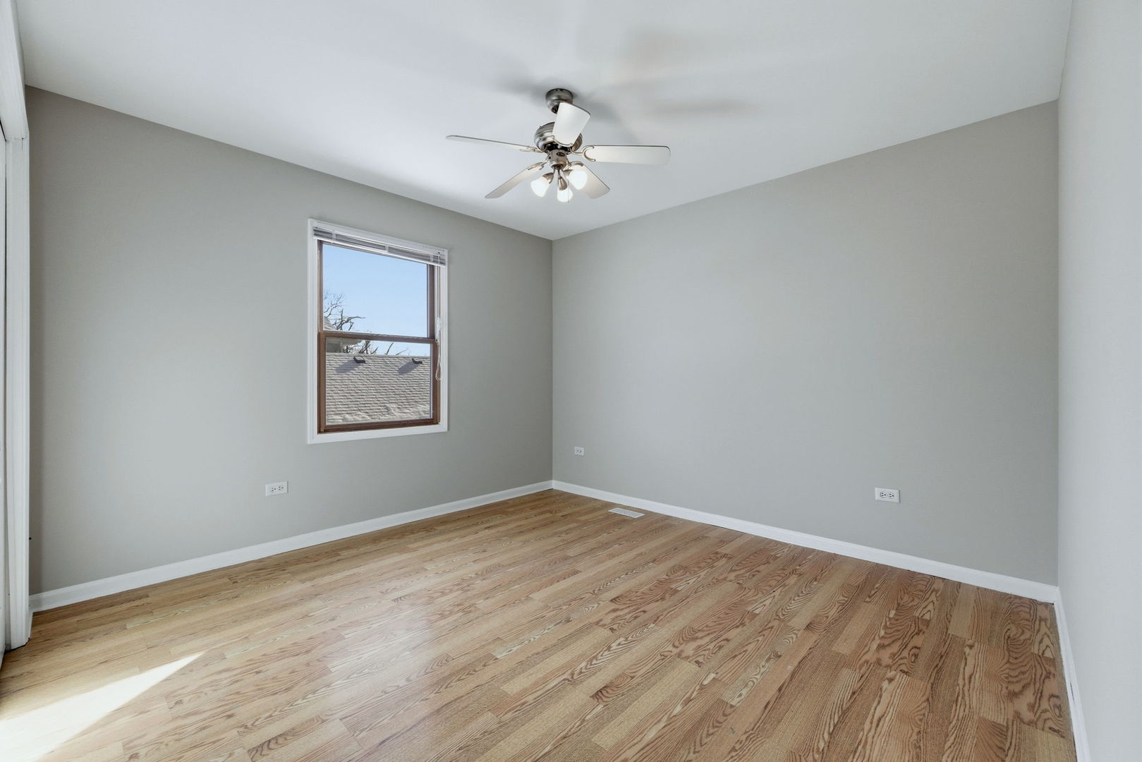 1305 Campbell Street Joliet, IL 60435 - Photo 20 of 34 wooden floor in an empty room with a window