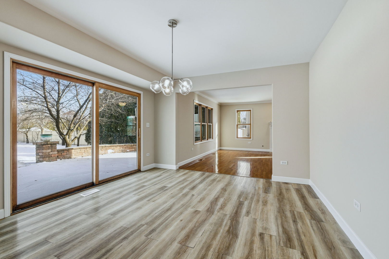 1305 Campbell Street Joliet, IL 60435 - Photo 8 of 34 a view of empty room with wooden floor and fan