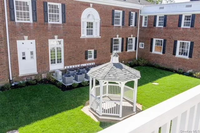 a view of balcony with wooden fence and trees