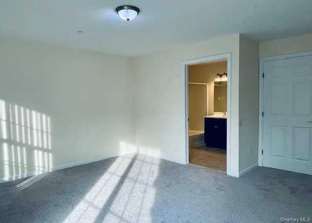 a view of a bedroom with wooden floor and a window