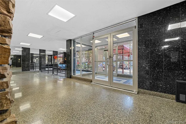 a bathroom with a glass shower door