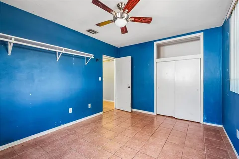 a view of an empty room with a fan