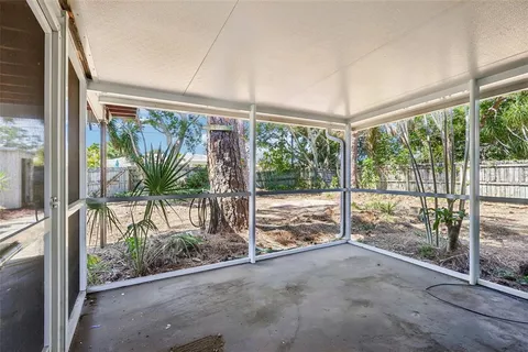 a view of a room with balcony and ocean view