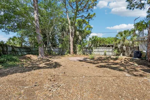 a view of a yard with a tree