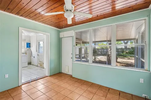 a view of a room with window and hallway