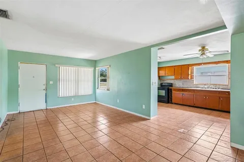 a view of a kitchen with microwave and cabinets