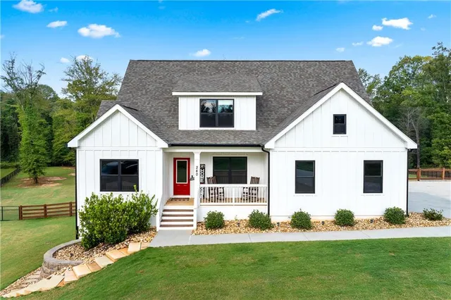 a view of a dining room with furniture wooden floor and chandelier