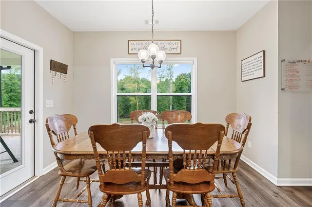 a bed sitting in a spacious bedroom next to a window