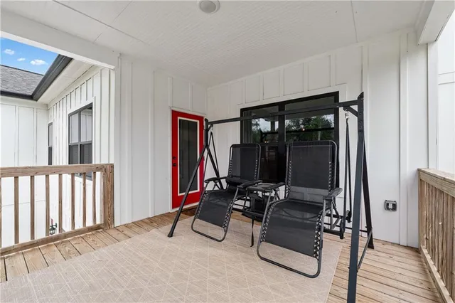 a spacious bedroom with a bed and a ceiling fan