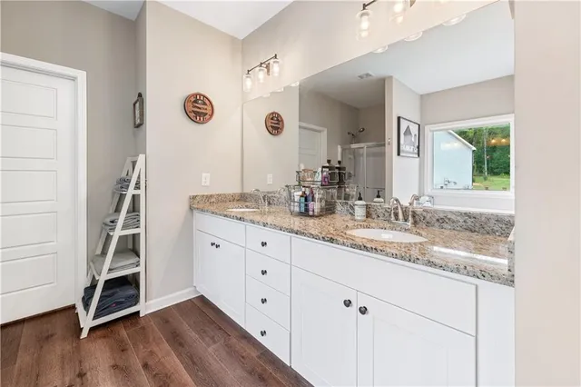 a view of a workspace with furniture and a ceiling fan