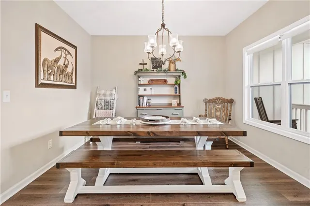a kitchen with appliances a sink a counter top space and cabinets