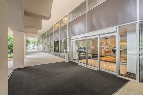 a view of an empty room with floor to ceiling window