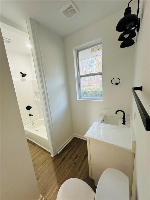 25 4th Street Gainesville, GA 30504 - Photo 19 of 20 a bathroom with a toilet sink and mirror