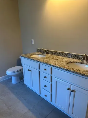 a bath tub sitting in a bathroom next to a window