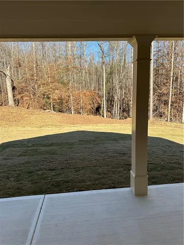 a large kitchen with granite countertop a sink dishwasher a stove and a refrigerator