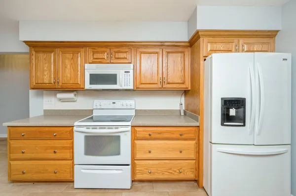 a kitchen with a stove and a refrigerator