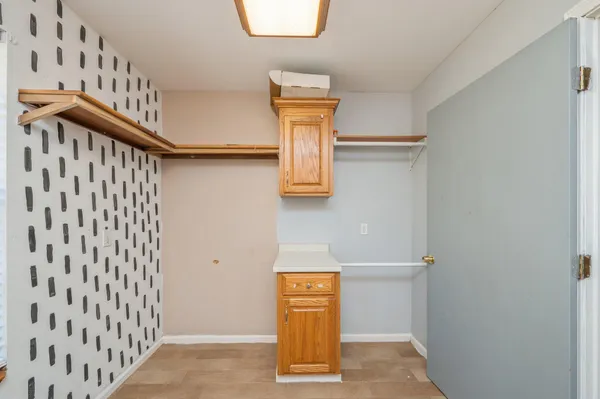 a view of an entryway with wooden floor