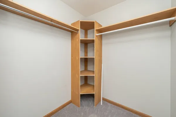 a view of an empty room and cabinet