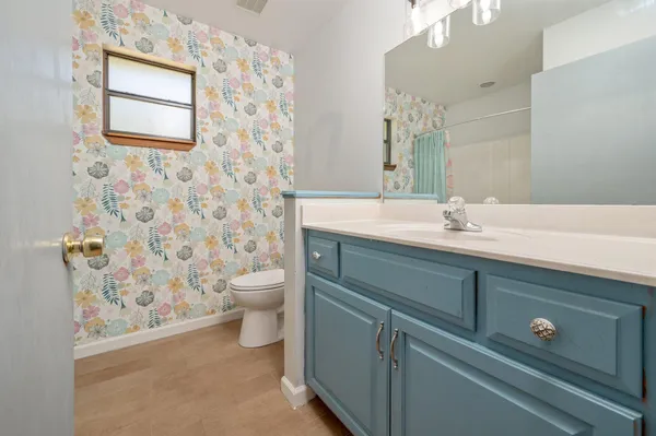 a bathroom with a shower and a curtain