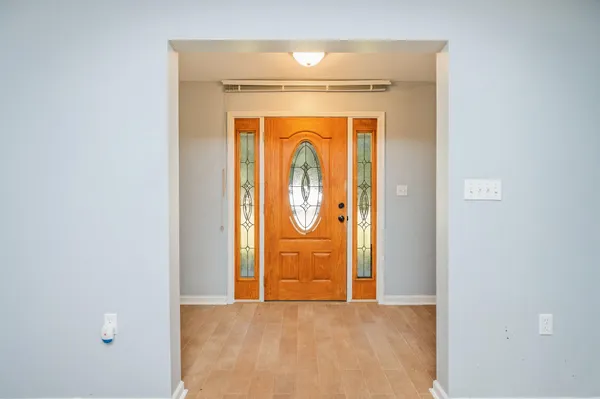 a view of front door with wooden door