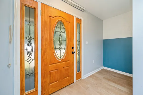 an empty room with windows and exposed view