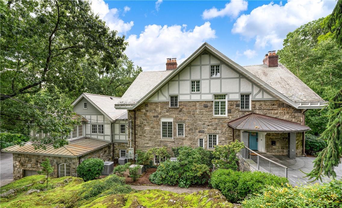 a front view of a house with yard