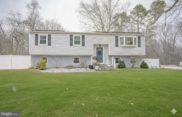 a front view of house with yard and seating area