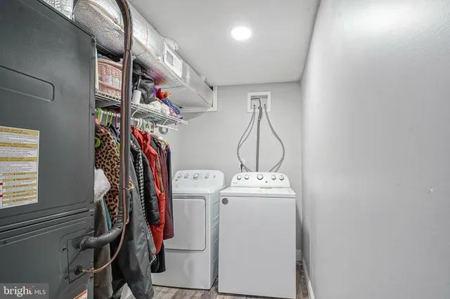 a view of storage and utility room with washer and dryer