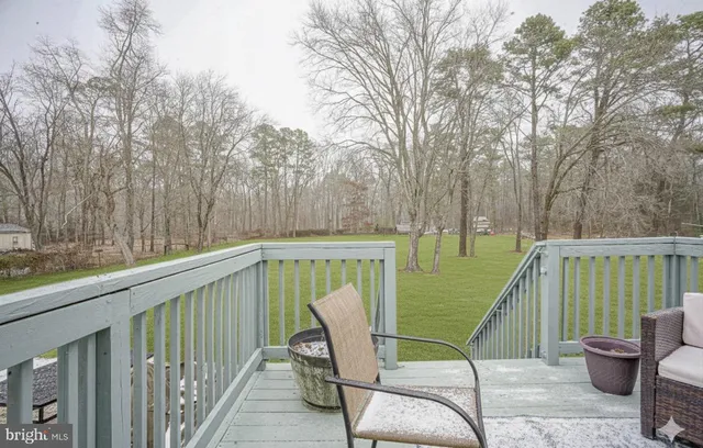 a view of a two chairs on the roof deck