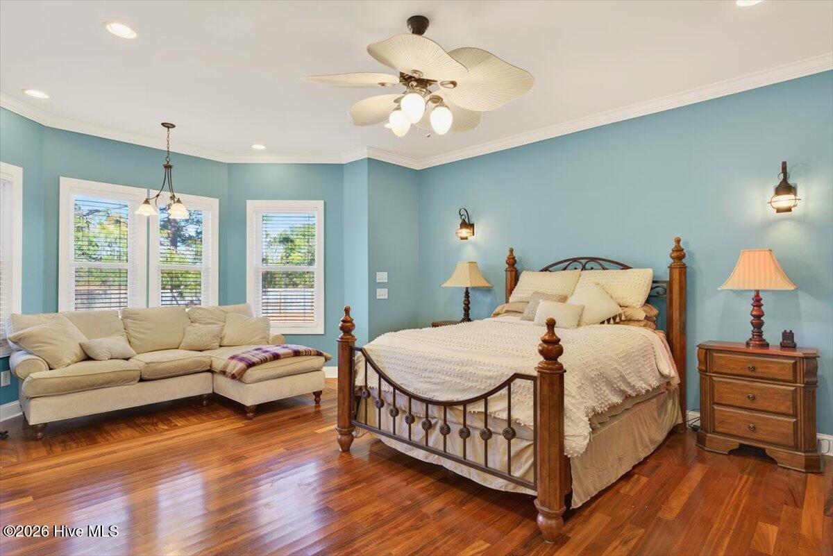 18 Brierwood Road Southwest Shallotte, NC 28470 - Photo 21 of 70 Spacious primary suite on the main level with hardwood floors and relaxing, private atmosphere.