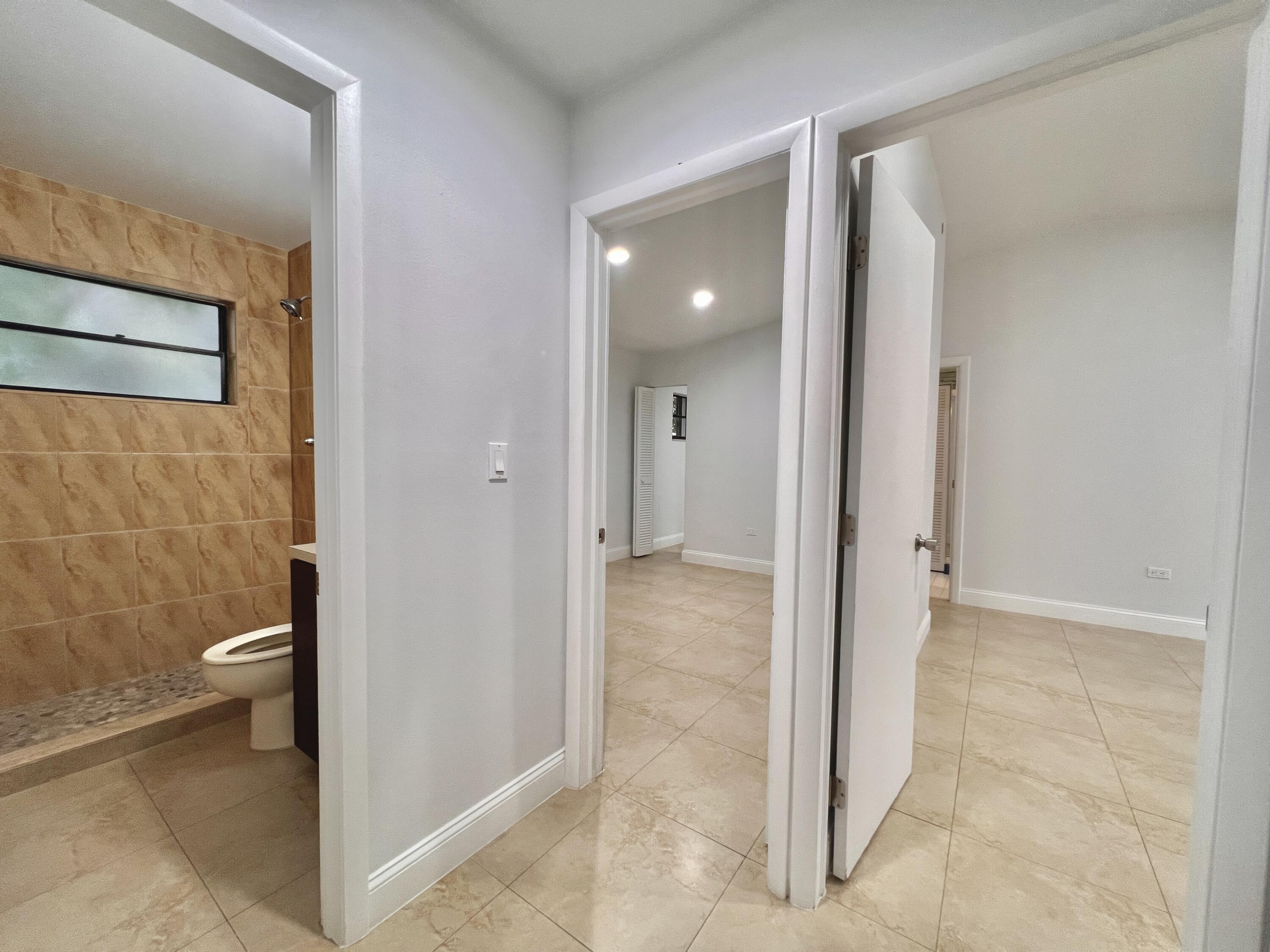414 Coconut Drive Key Largo, FL 33037 - Photo 12 of 36 a view of a bathroom with toilet