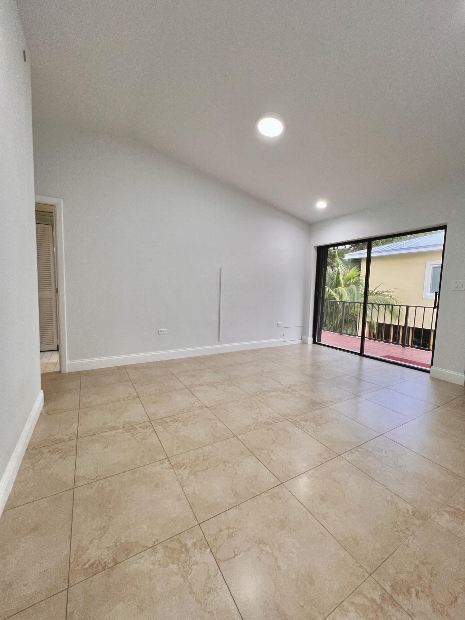 414 Coconut Drive Key Largo, FL 33037 - Photo 16 of 36 a view of an empty room with a window