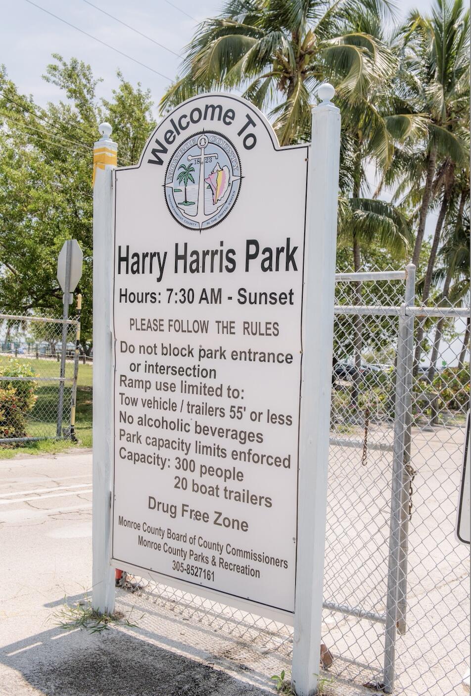 414 Coconut Drive Key Largo, FL 33037 - Photo 30 of 36 a sign on a pole on a street