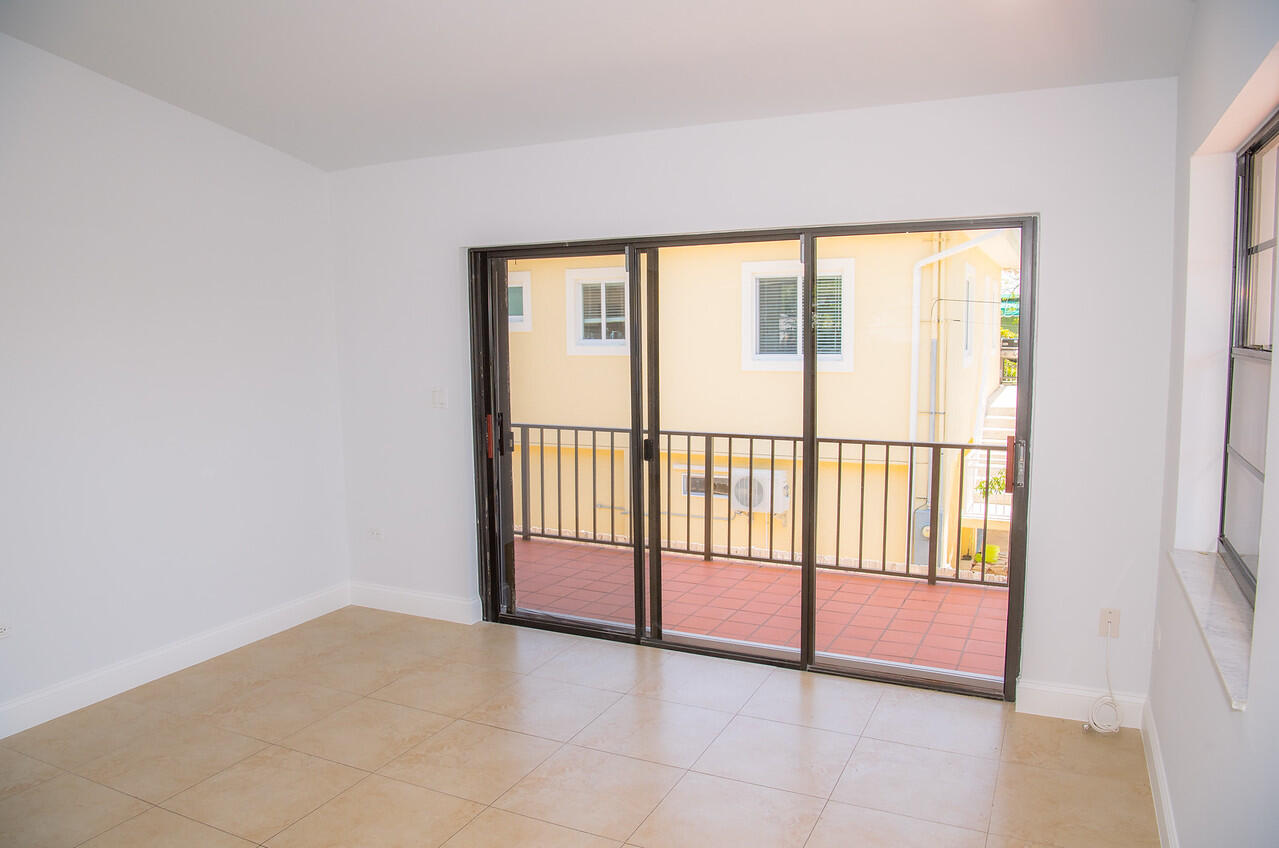 414 Coconut Drive Key Largo, FL 33037 - Photo 9 of 36 a view of empty room with floor to ceiling window