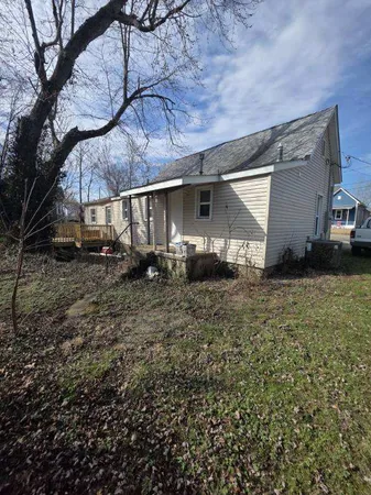 a house view with a backyard space