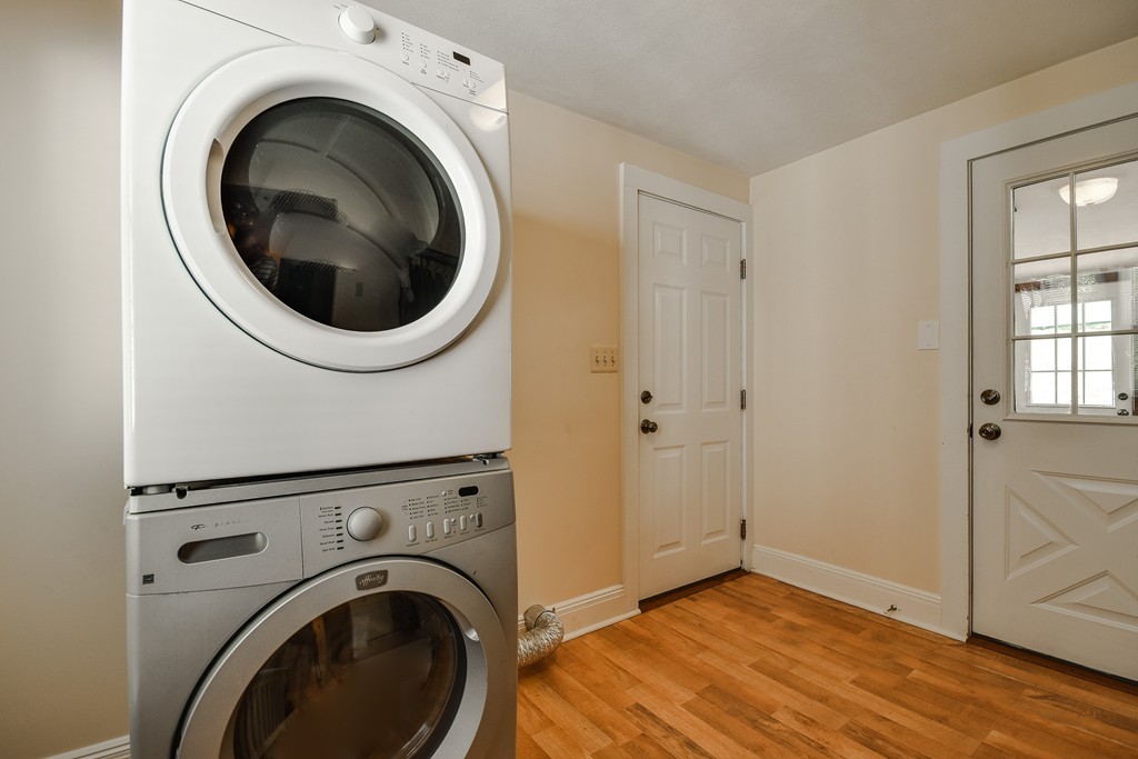 54 Spring Street Hopkinton, MA 01748 - Photo 8 of 22 a view of a hallway with washer and dryer