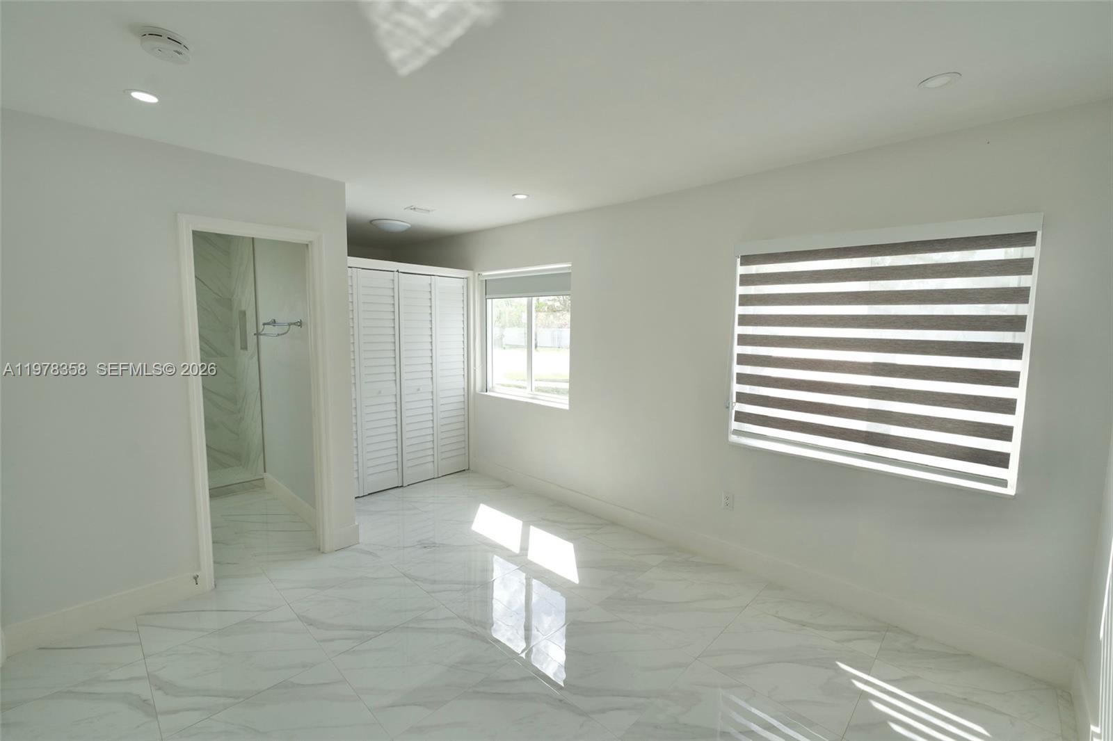 10381 Southwest 32nd Street Miami, FL 33165 - Photo 11 of 38 a view of empty room with a window