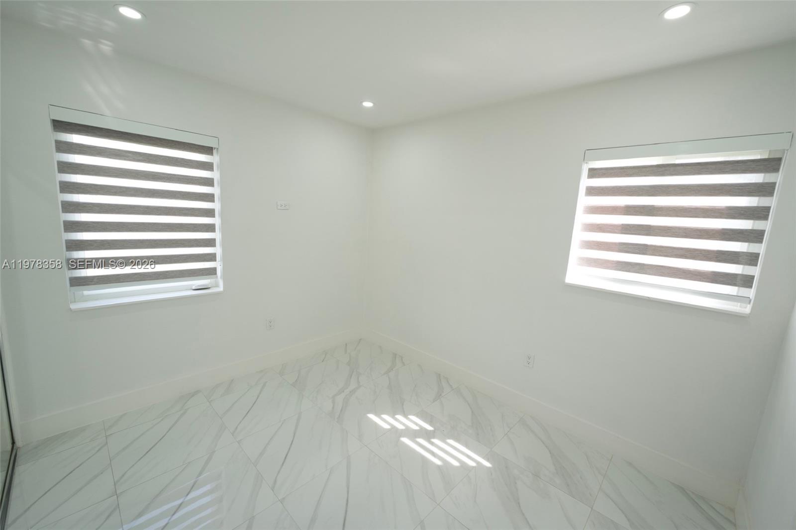 10381 Southwest 32nd Street Miami, FL 33165 - Photo 18 of 38 a view of a small space with a window